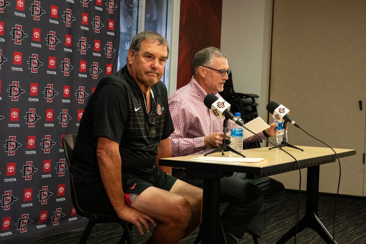 San Diego State football coach Brady Hoke, left, and Athletic Director J.D. Wicker at news conference Monday.