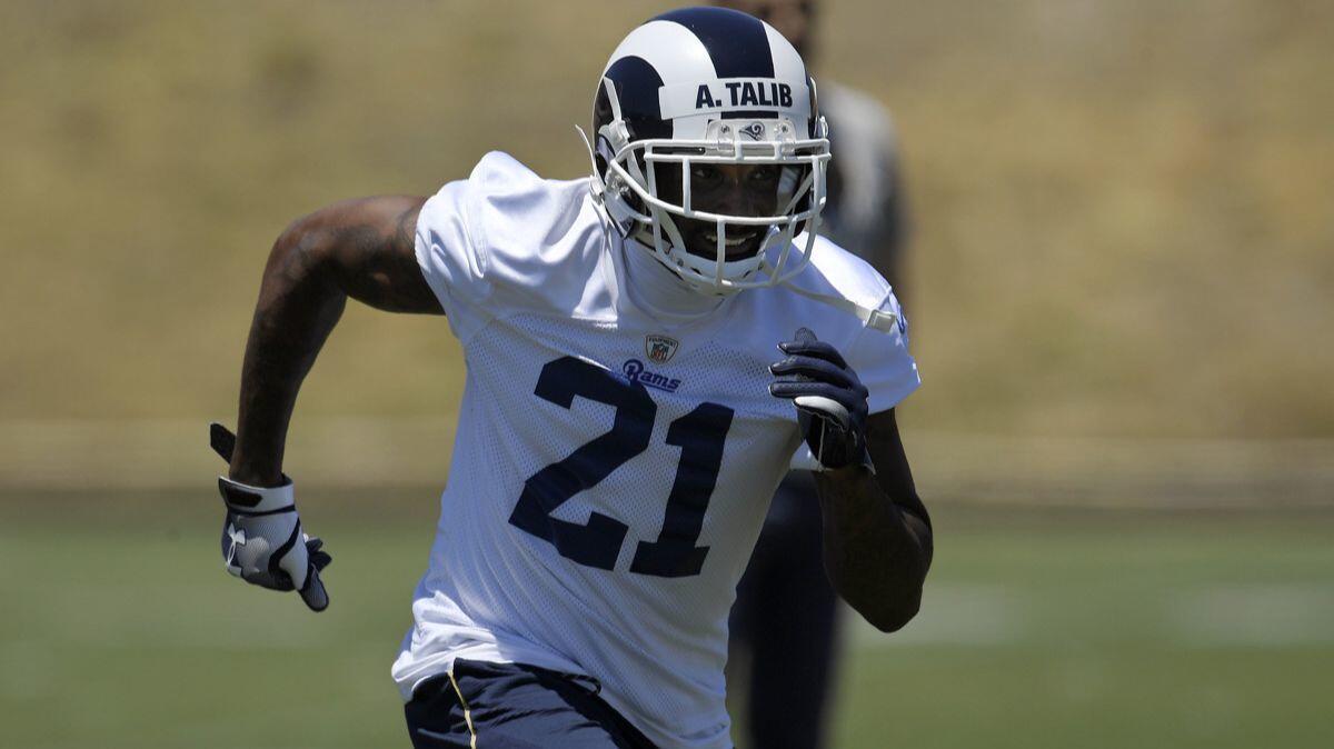 Rams defensive back Aqib Talib runs a play during practice at the team's mini camp in Thousand Oaks.