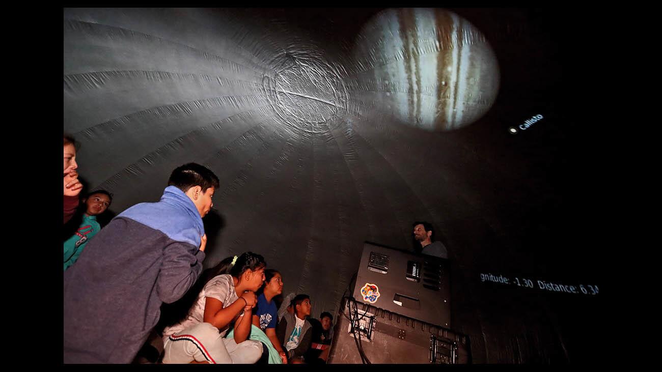 Photo Gallery: Oak View Elementary students view sky under mobile planetarium