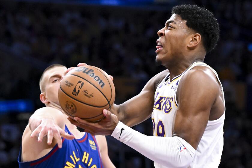 LOS ANGELES, CA - MAY 20: Los Angeles Lakers forward Rui Hachimura, right, goes up for a shot,