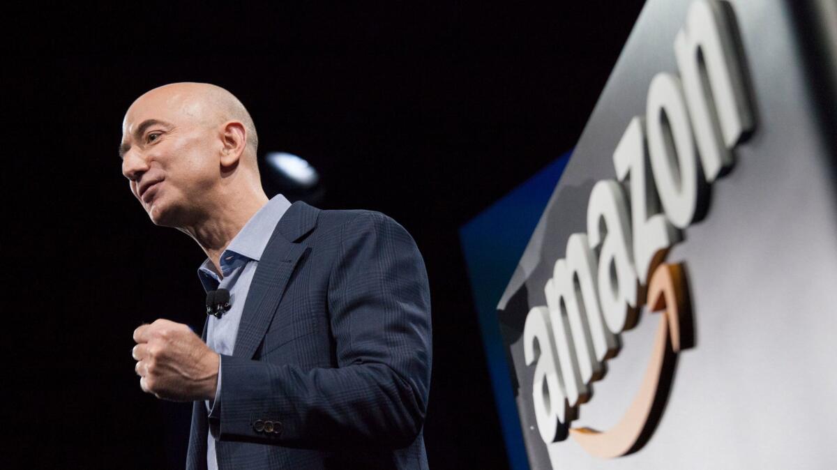 Amazon.com founder and CEO Jeff Bezos presents the company's first smartphone, the Fire Phone, on June 18, 2014 in Seattle.