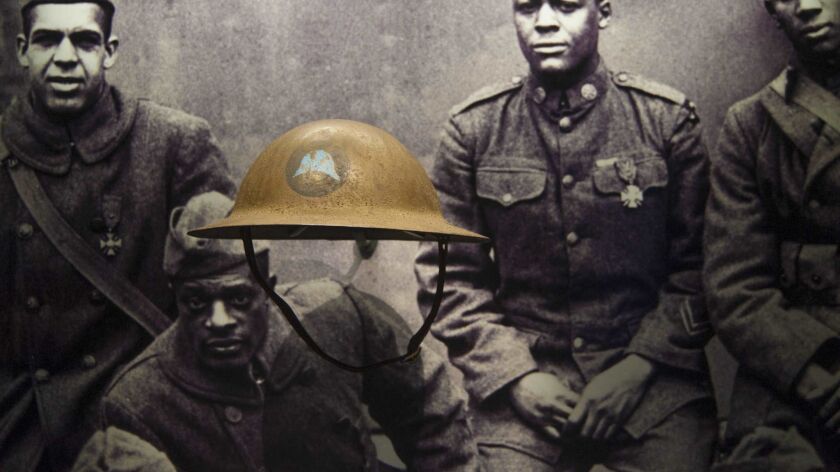A helmet from the World War I Harlem Hellfighters is on display during a press preview at the Smithsonian's National Museum of African American History and Culture in Washington on Sept. 14, 2016.