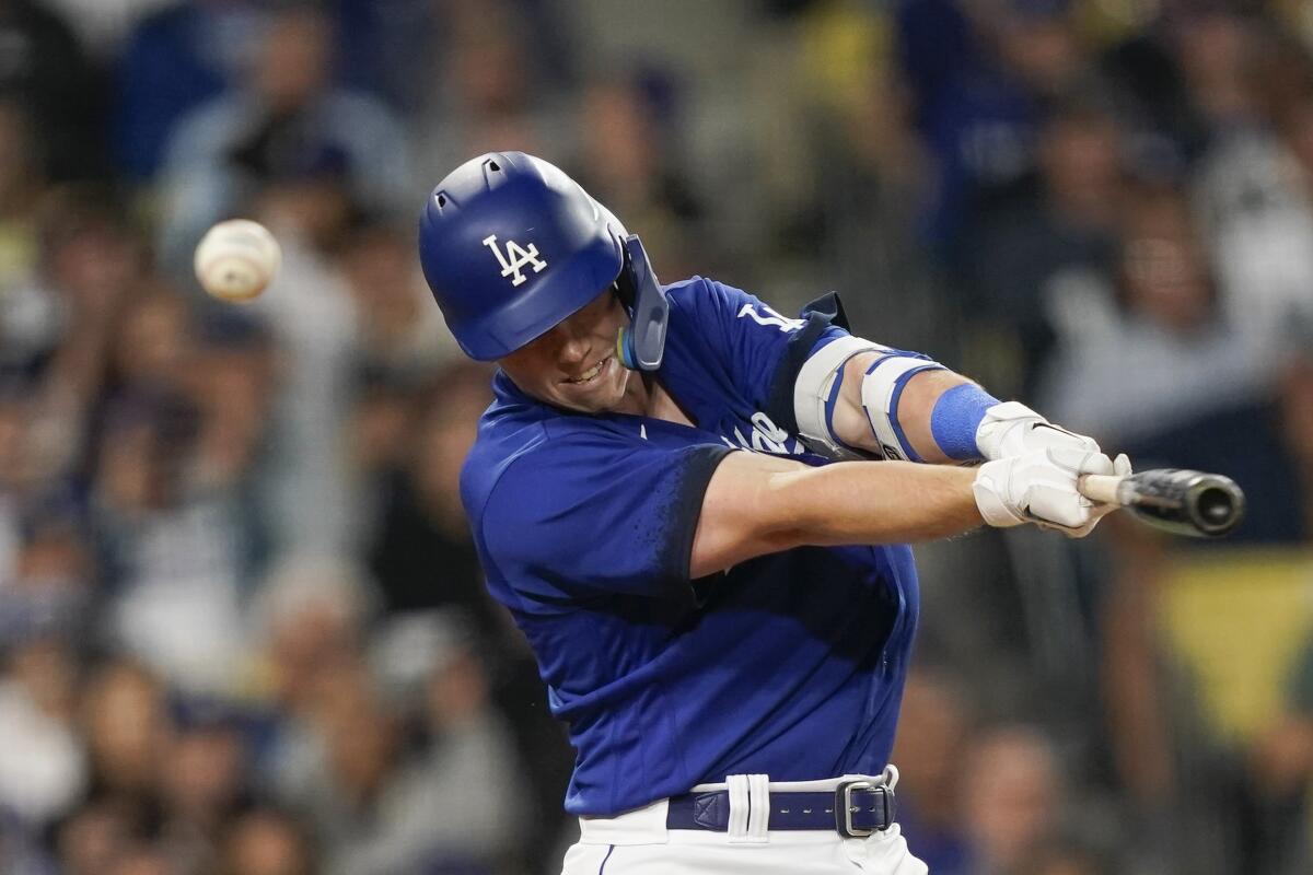 Los Angeles Dodger catcher Will Smith reacts after catching a foul