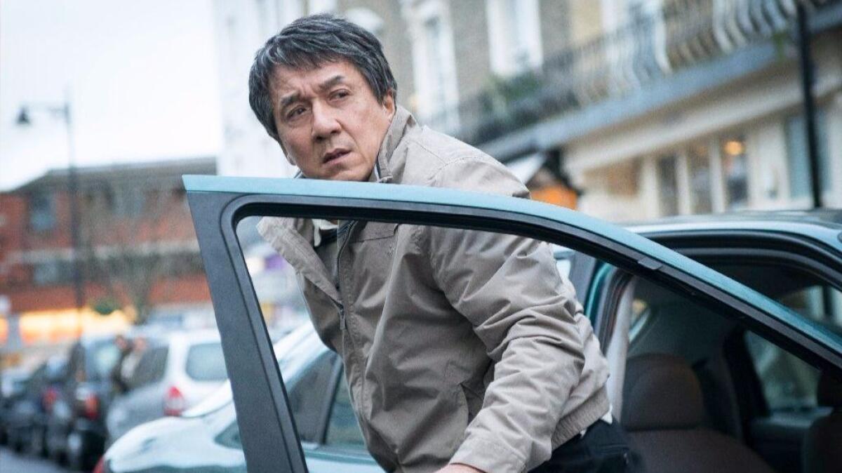 Quan (Jackie Chan) looks out for his daughter after dropping her off at a local shop just before a fatal bombing occurs in "The Foreigner." (Christopher Raphael / STX Productions)