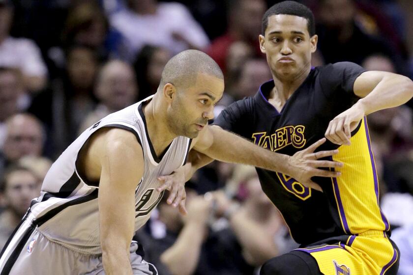 Lakers rookie guard Jordan Clarkson, right, held his own for most of the game against Spurs veteran Tony Parker on Friday night.