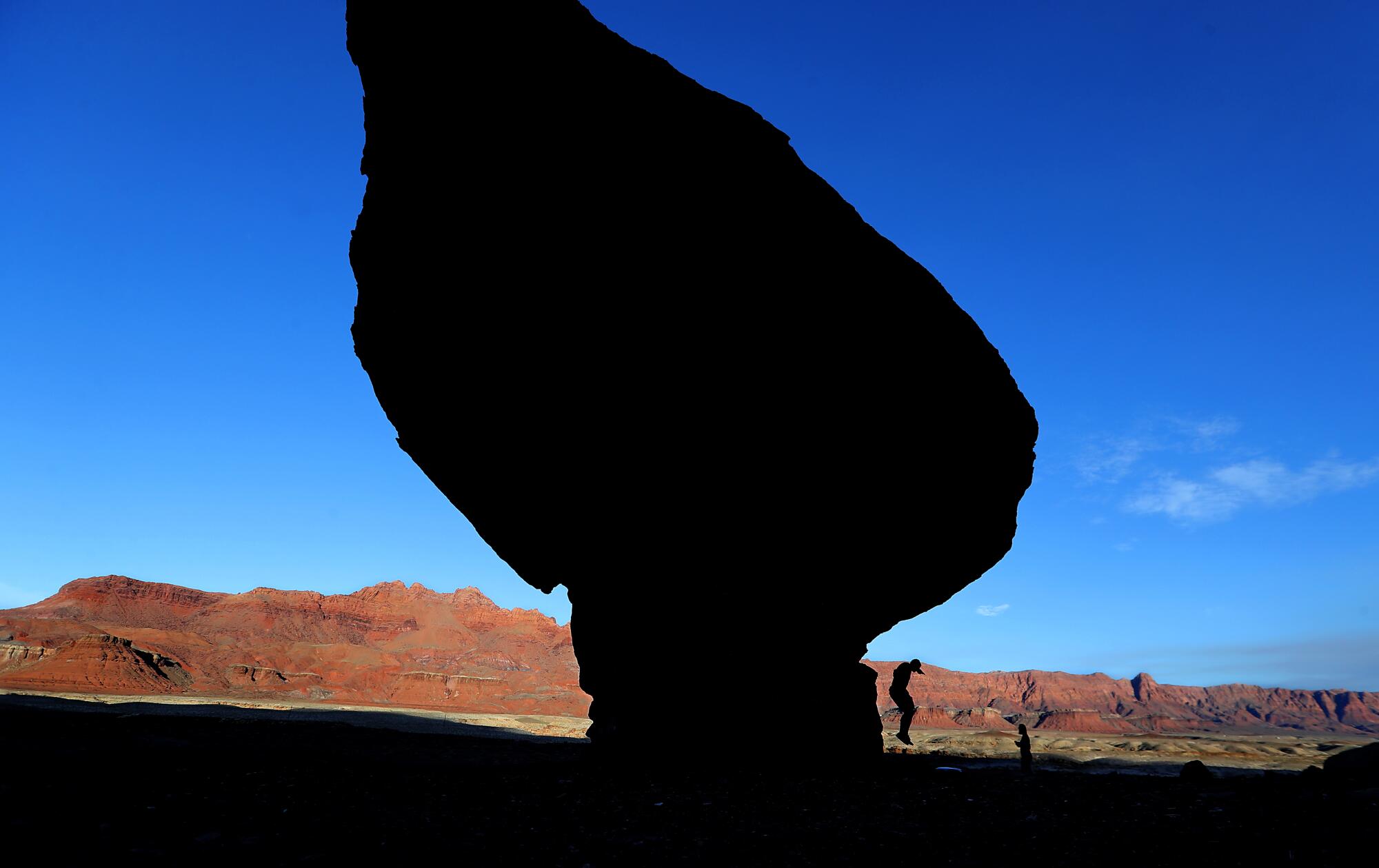 The silhouette of a wedge of rock. 