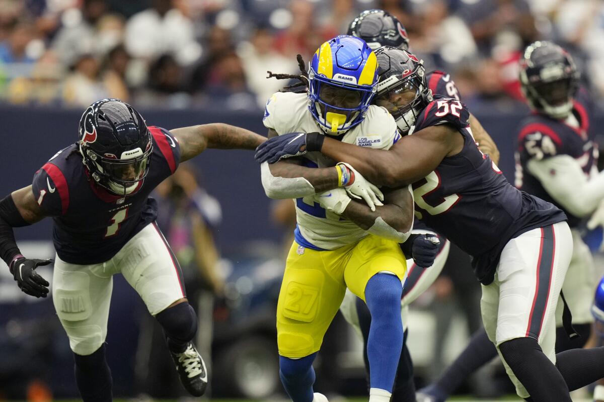 Darrell Henderson runs the ball during the first half.