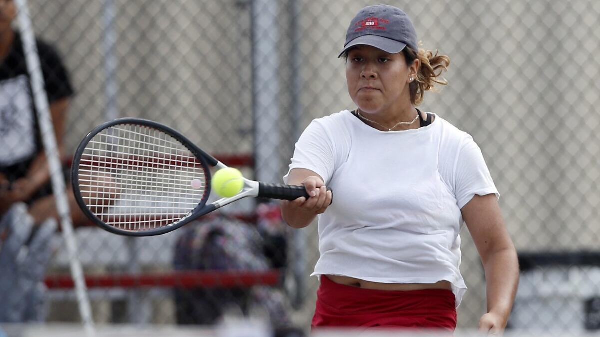 Estancia High's Leslie Hernandez competes in a No. 2 singles set against Costa Mesa during an Orange Coast League match at Estancia High on Tuesday.