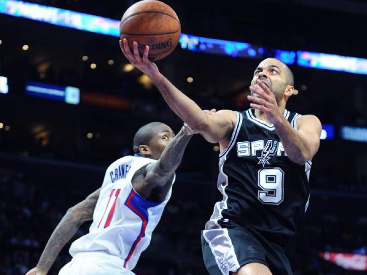 San Antonio guard Tony Parker drives past Jamal Crawford, but misses a layup during Game 5 of a playoff series matchup between the Clippers at Spurs at Staples Center.