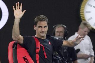 Switzerland's Roger Federer waves as he leaves Rod Laver Arena 