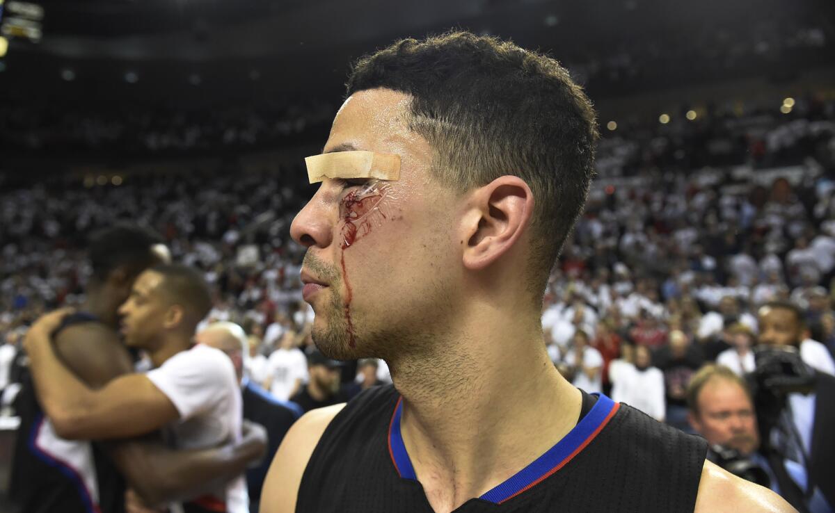 Clippers guard Austin Rivers walks off the court, 11 stitches and all, after the Game 6 loss to the Trail Blazers.