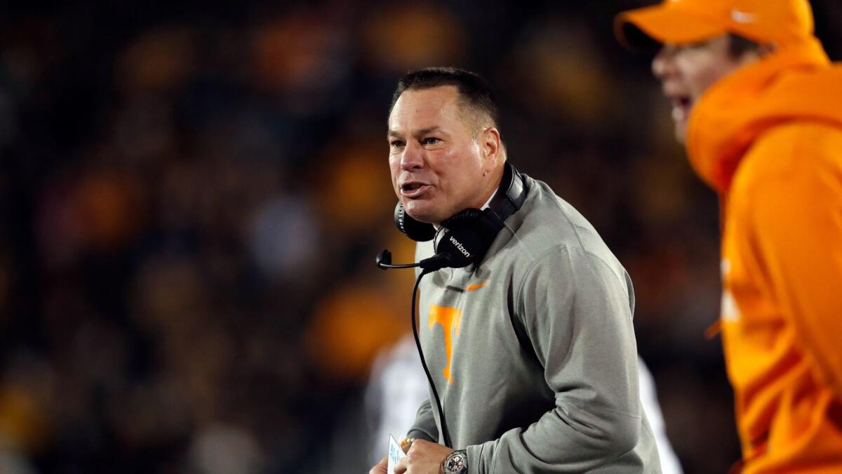 Tennessee head coach Butch Jones watches from the sidelines during the first half of a game against Missouri.