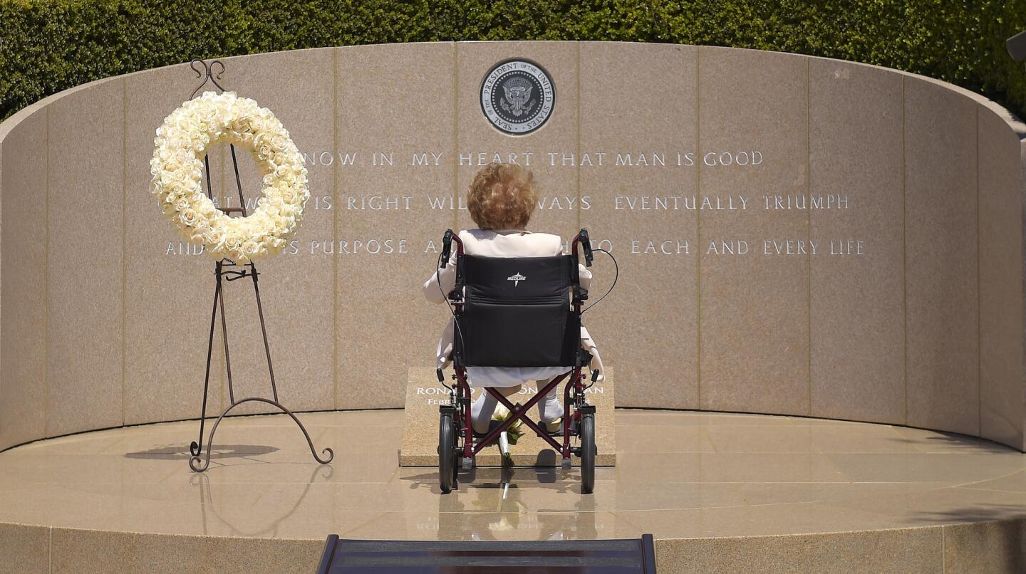 In this June 5, 2014, file photo, former first lady Nancy Reagan visits the grave site of her husband, President Ronald Reagan, at the Ronald Reagan Presidential Library, in Simi Valley, Calif.