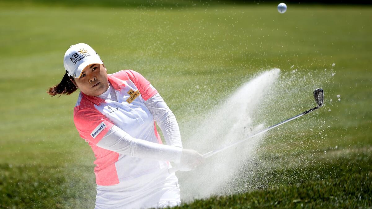 Inbee Park hits out of a greenside sand trap at No. 1 during the third round of the KPMG Women's PGA Championship on Saturday.