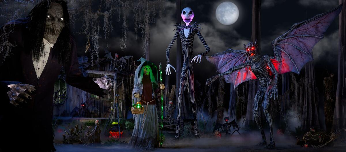 Jack Skellington is set up among other dark figures in a spooky front-yard display. 