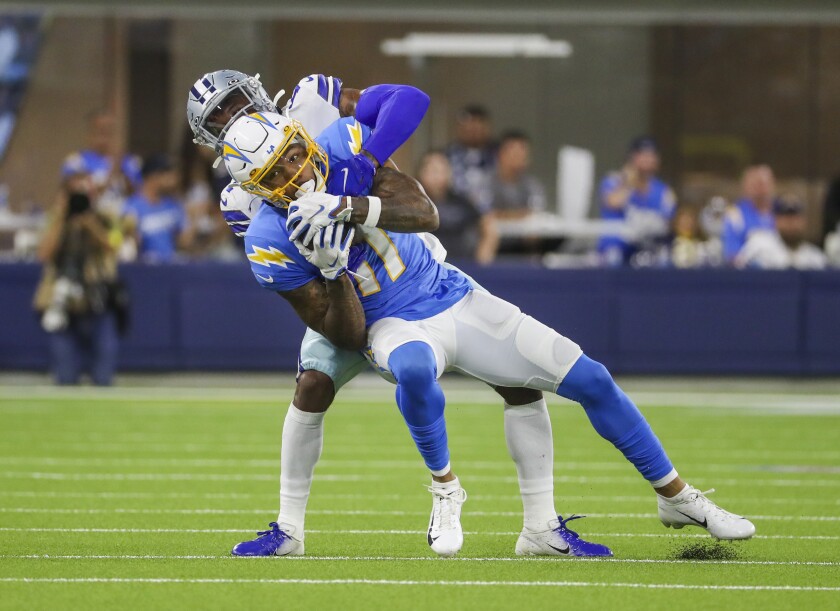 Dallas Cowboys cornerback Kelvin Joseph tackles Chargers wide receiver Jason Moore Jr.