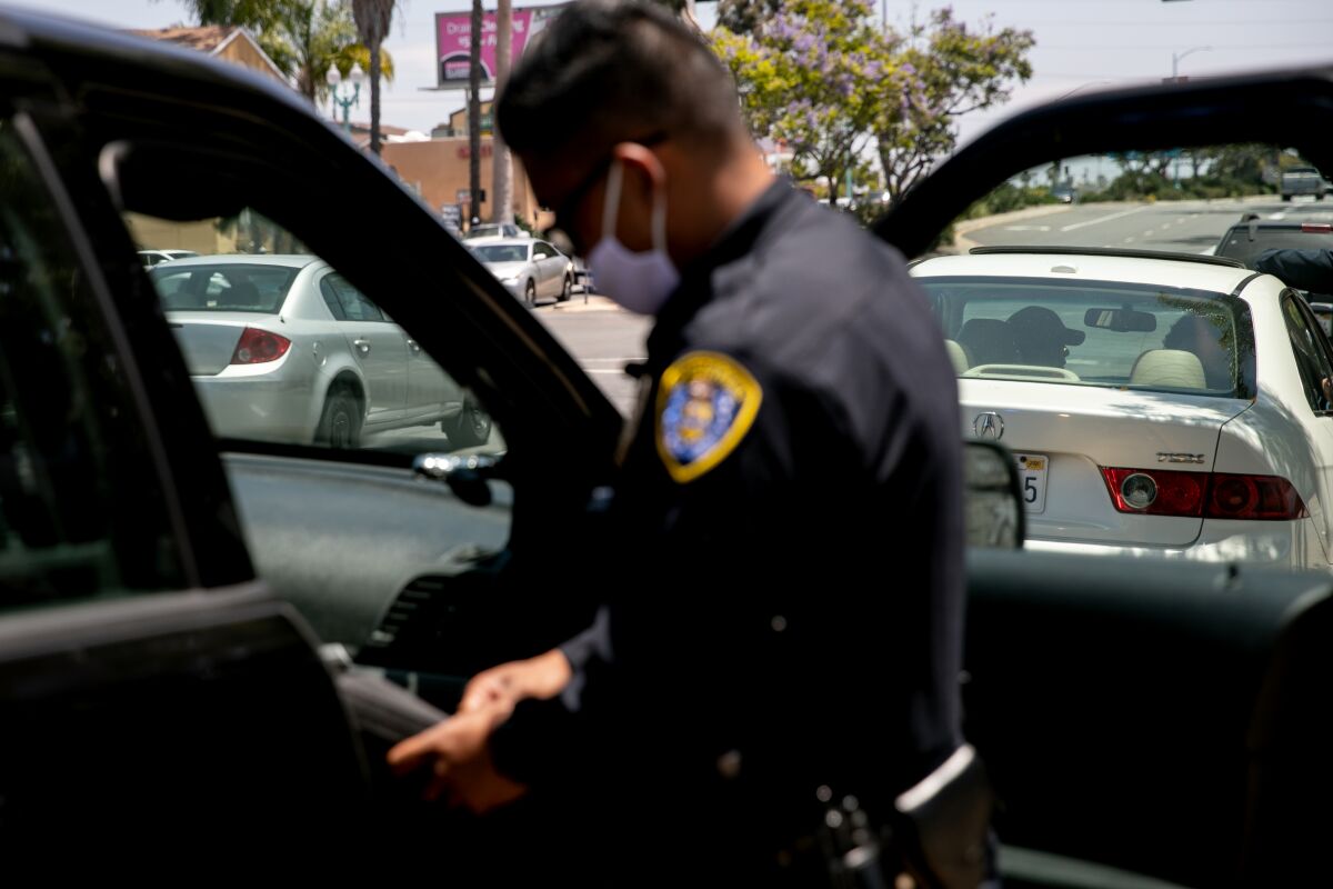 San Diego Police Department officers make a traffic stop along El Cajon Boulevard on June 23, 2020 in San Diego.
