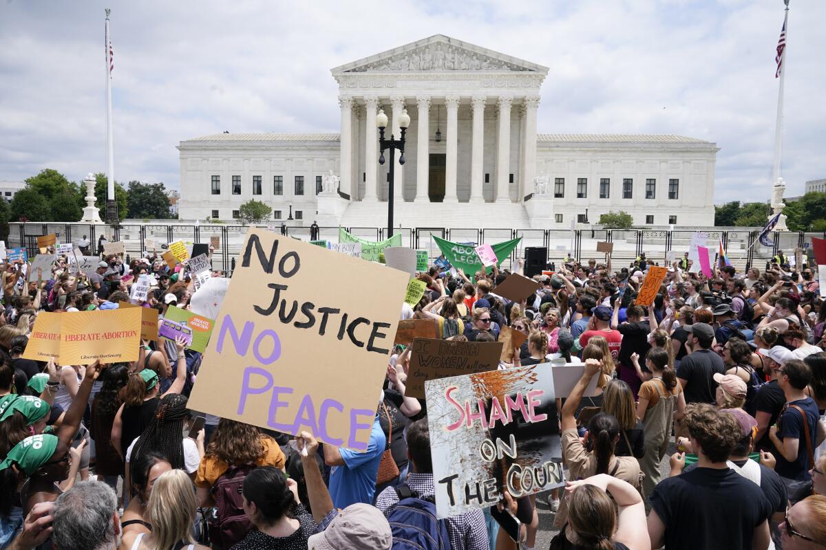 Protesters gather outside the Supreme Court in Washington, Friday, June 24, 2022.