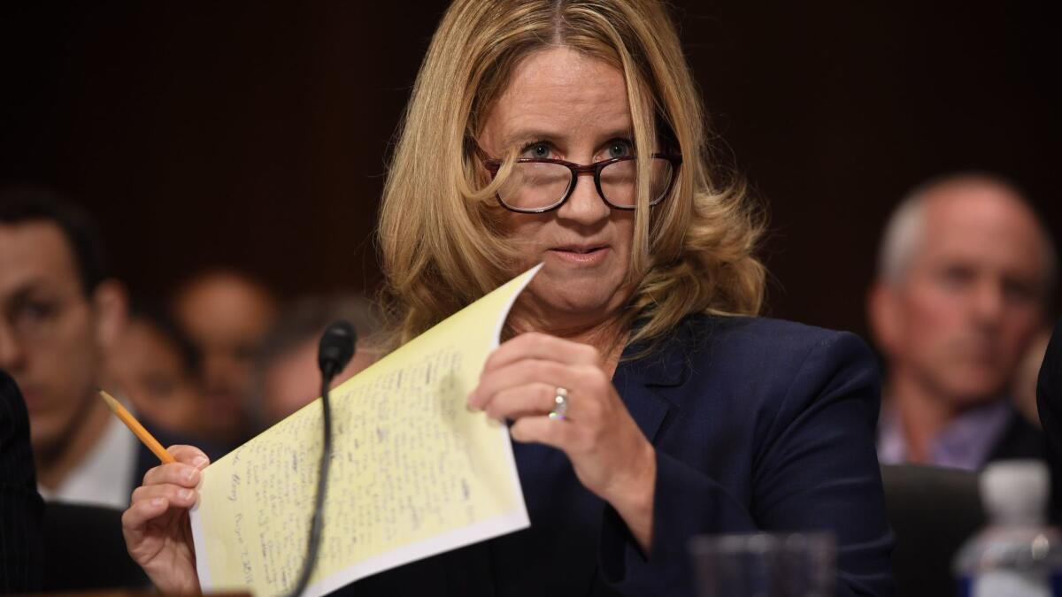 Christine Blasey Ford holds a page of notes during the hearing.