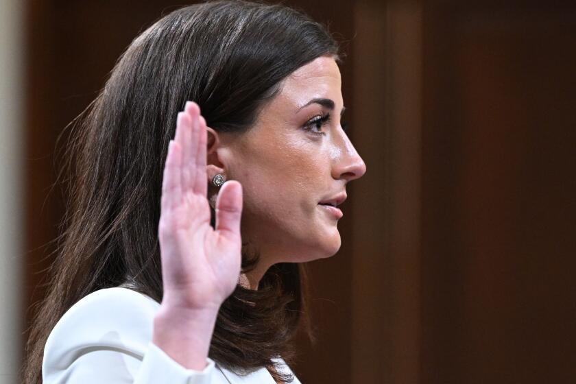 Cassidy Hutchinson, an aide to then White House chief of staff Mark Meadows, is sworn-in during a House Select Committee hearing to Investigate the January 6th Attack on the US Capitol, in the Cannon House Office Building on Capitol Hill in Washington, DC on June 28, 2022. (Photo by MANDEL NGAN / AFP) (Photo by MANDEL NGAN/AFP via Getty Images)