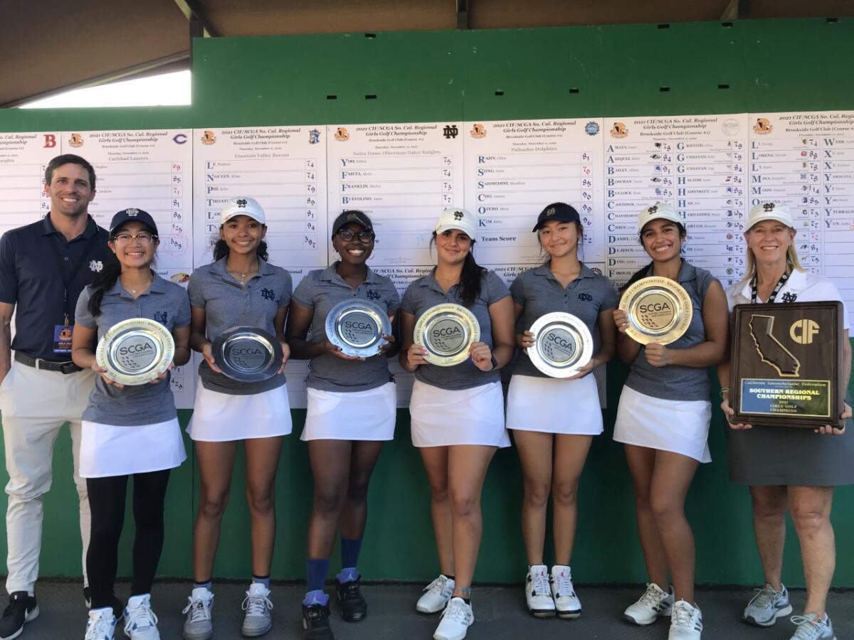 Sherman Oaks Notre Dame's girls' golf team poses with coach Ann McClung (right) after winning CIF/SCGA championship.