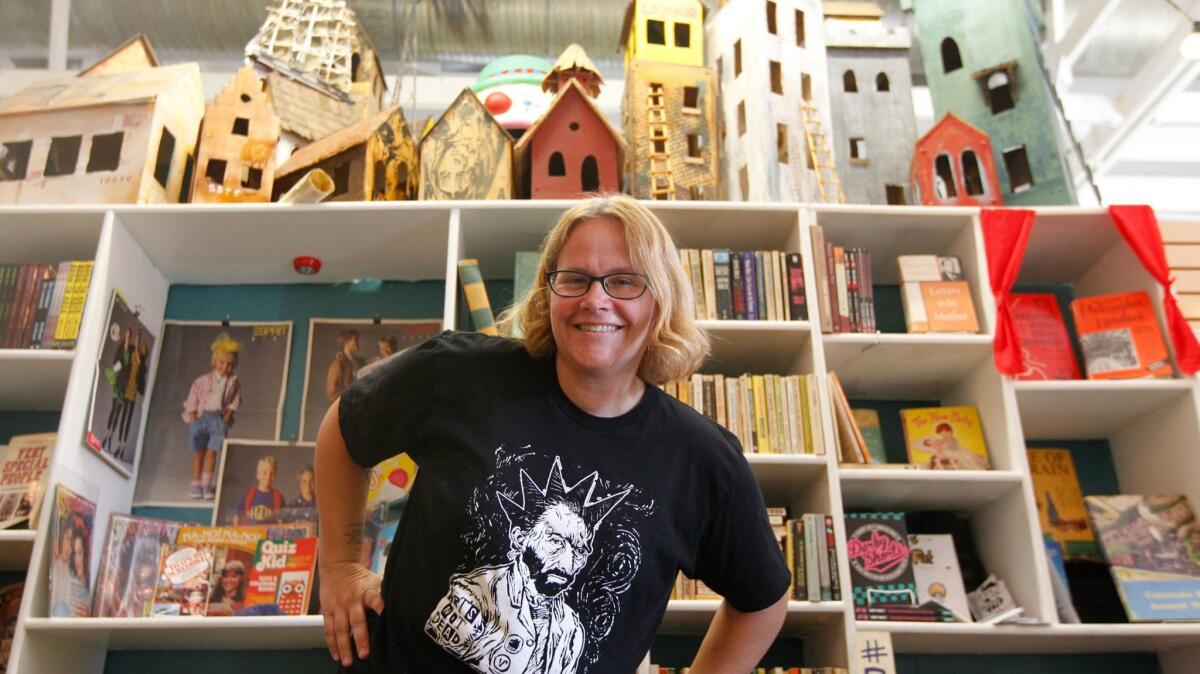 Proprietor Jen Hitchcock in Book Show's first location; the eclectic local bookstore is now in Highland Park.