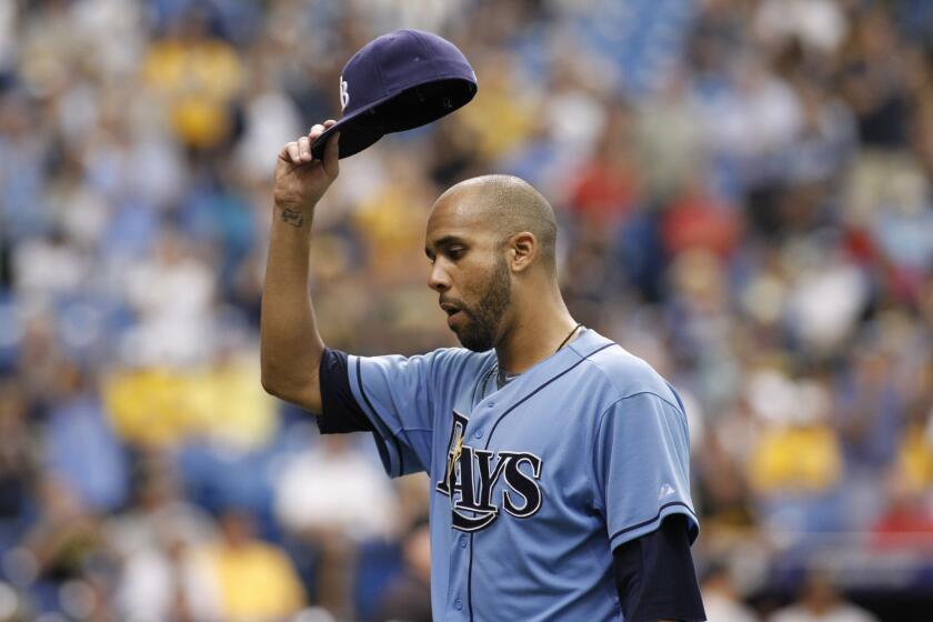 Tampa Bay pitcher David Price lifts his cap to the crowd Wednesday at Tropicana Field.