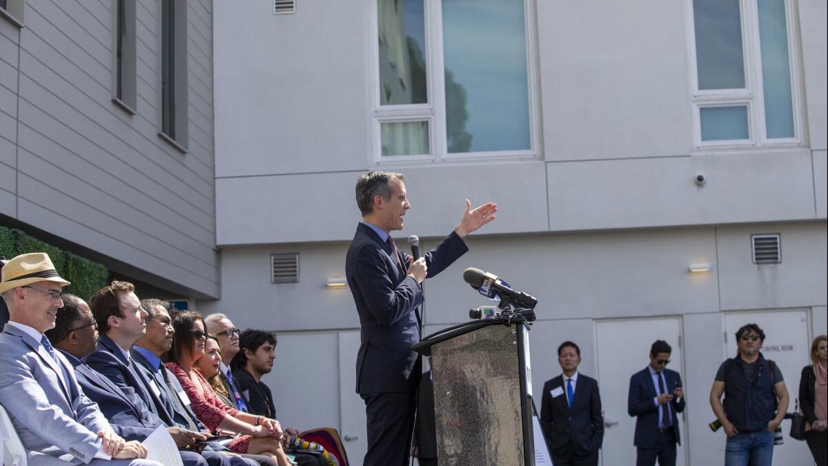 Mayor Eric Garcetti speaks during the grand opening of the PATH Metro Villas, a supportive-housing development in Los Angeles.