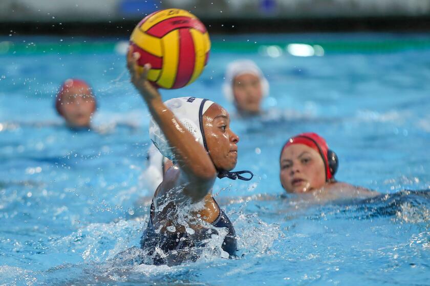 Newport Harbor's Angela Peterson shoots and scores during CIF Southern Section Open Division semifinal match against top-seeded Orange Lutheran on Wednesday at Orange Coast College.