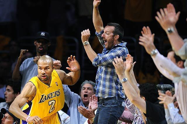 Lakers Derek Fisher celebrates with fans after his three-pointer against the Nugets in the 4th quarter in Game 1 of the Western Conference Finals at the Staples Center.