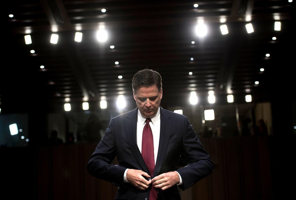 Former FBI Director James B. Comey attends a hearing before the Senate Select Committee on Intelligence hearing in Washington on June 8.