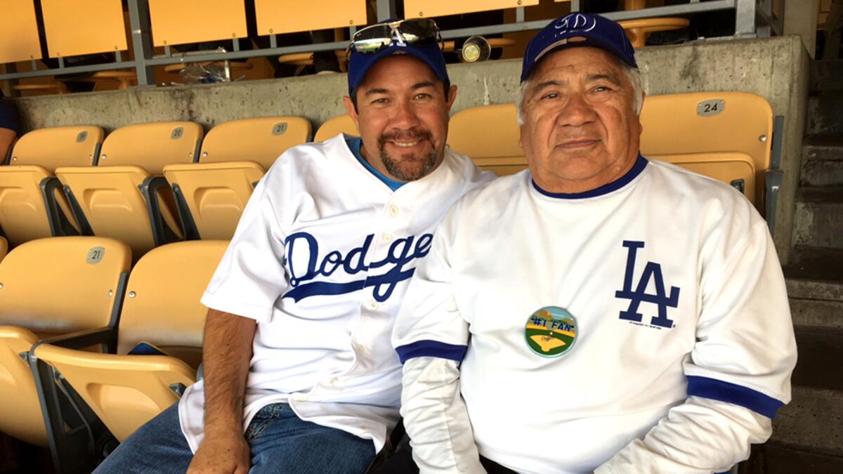 Anthony Diaz surprised his father, Afle, with Game 7 tickets on Tuesday night after the Dodgers won Game 6.