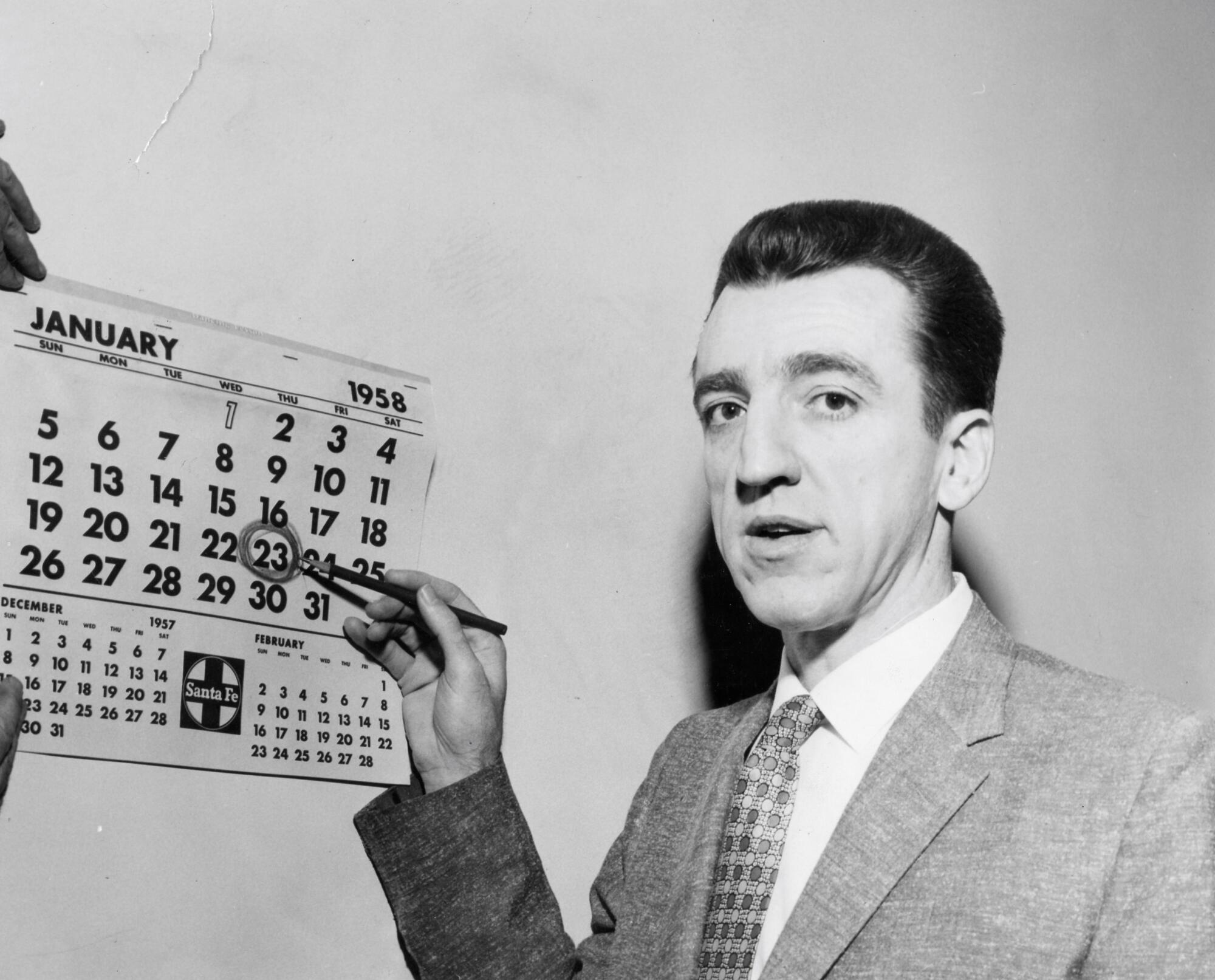 Caryl Chessman points to the date January 23 on a 1958 calendar, on the 10th anniversary of his arrest. 