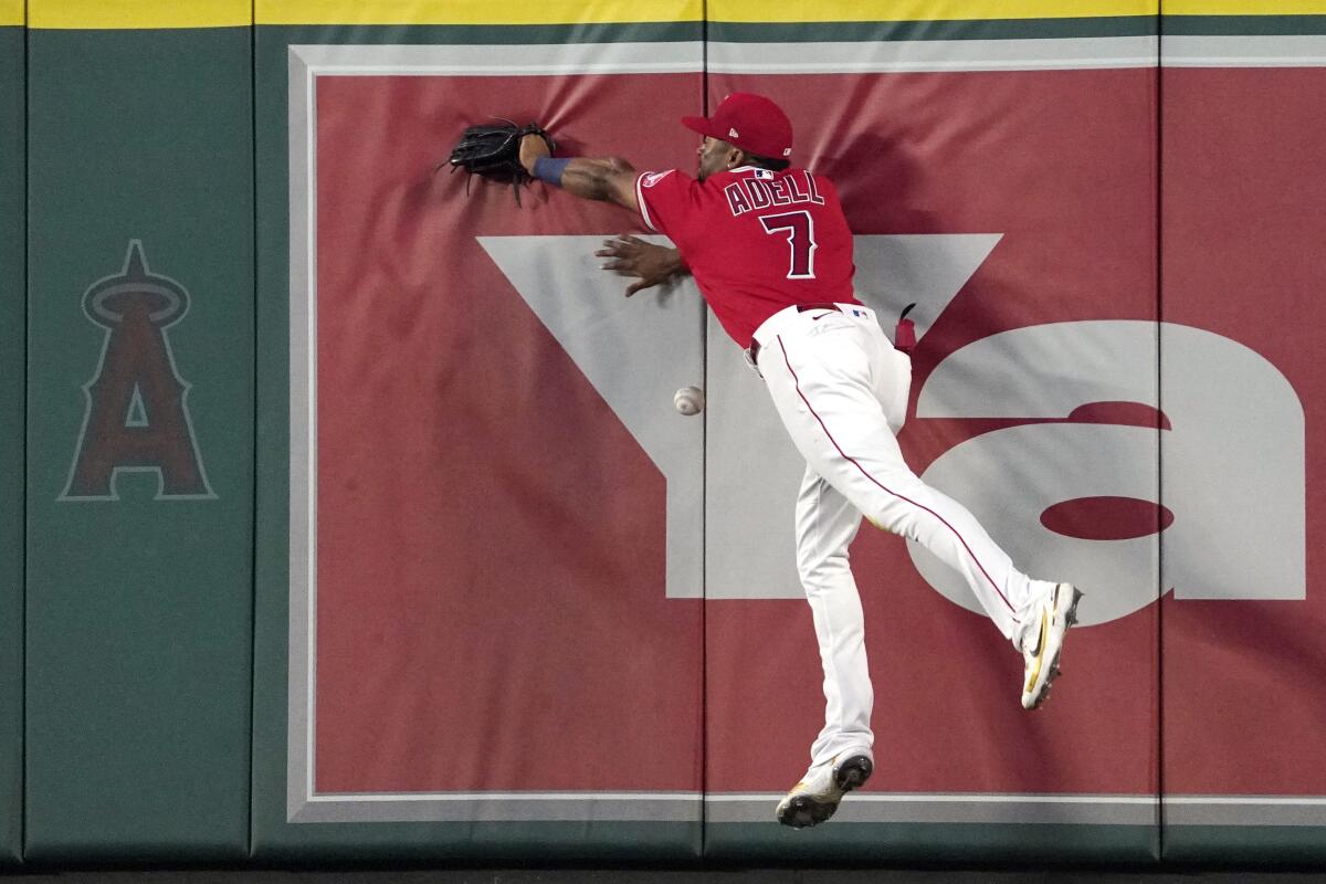 Angels right fielder Jo Adell can't catch a two-run triple hit by the Dodgers' Hanser Alberto during the fifth inning.