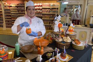 Candy maker, Candy Pruitt, works on spooky treats at Disneyland Park on Sept. 2, 2022.