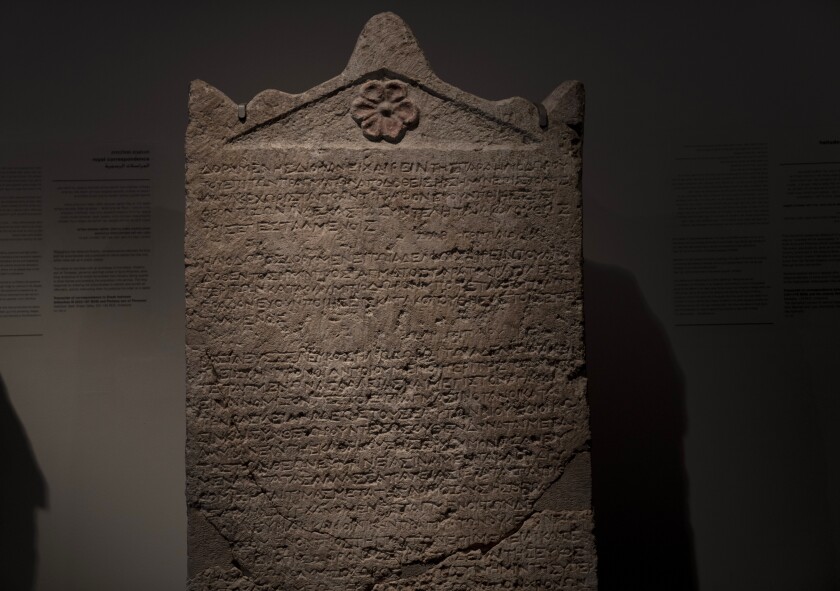 The Heliodorus Stele, loaned by American billionaire Michael Steinhardt, is displayed at the Israel Museum in Jerusalem, Wednesday, Jan. 5, 2022. Last month, Steinhardt surrendered the artifact, along with 179 others valued at roughly $70 million, as part of a landmark deal with the Manhattan District Attorney's office to avoid prosecution. Eight Neolithic masks loaned by Steinhardt to the Israel Museum for a major exhibition in 2014 were also seized as part of the billionaire's deal with New York authorities. (AP Photo/Maya Alleruzzo)