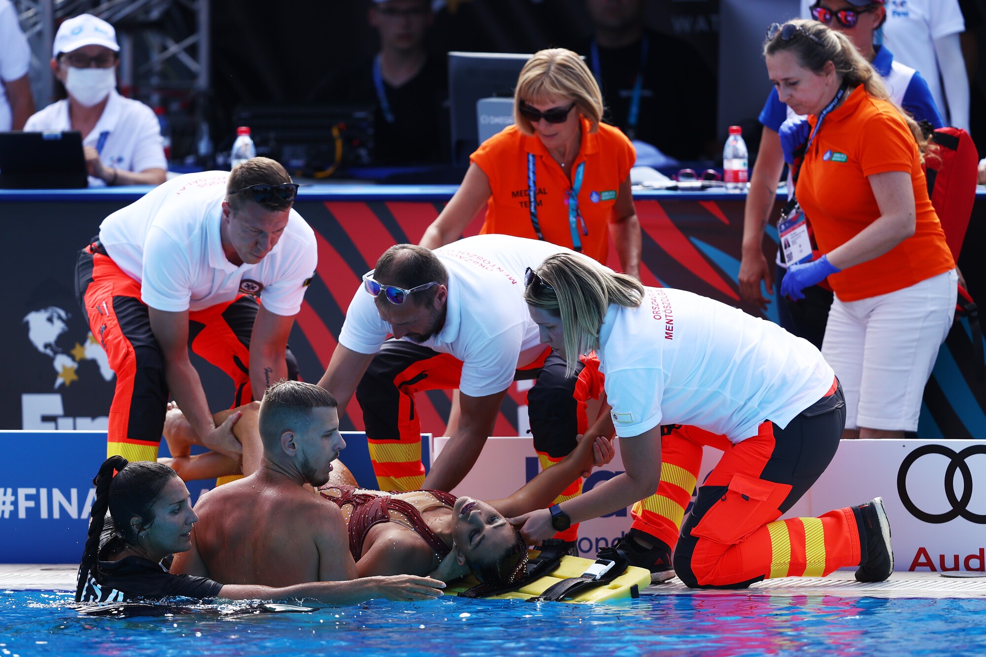 Anita Alvarez, from the USA team, is attended to by the medical team after her performance in the women's free solo final 
