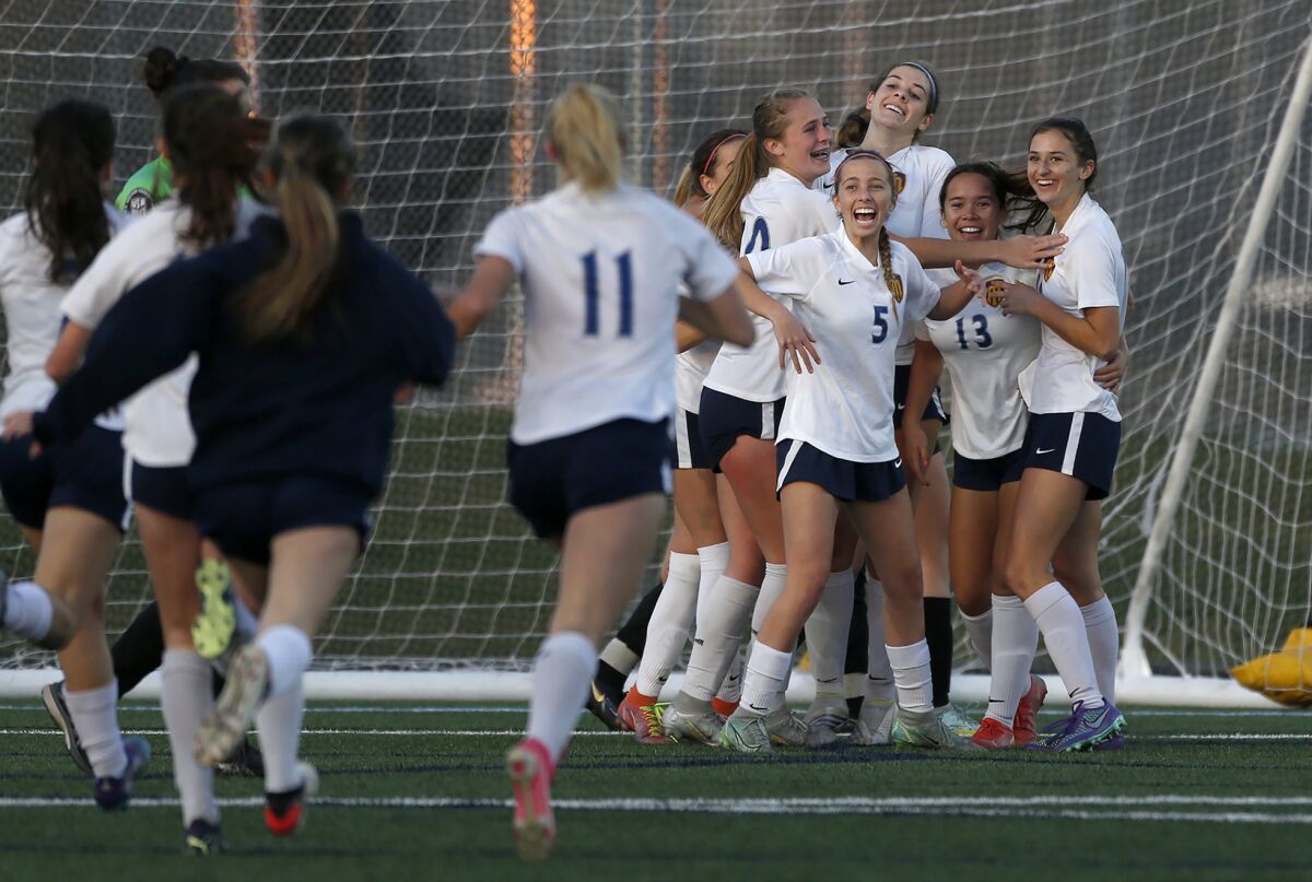 Marina celebrates defeating Corona del Mar in the final Wave League girls' soccer match on Wednesday.