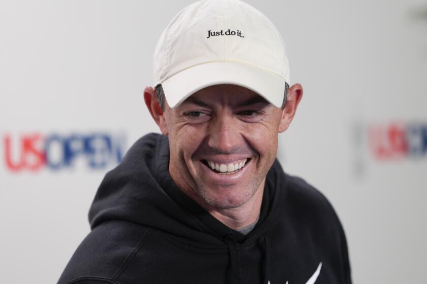 Rory McIlroy smiles as he speaks during a news conference at the U.S. Open golf tournament Tuesday