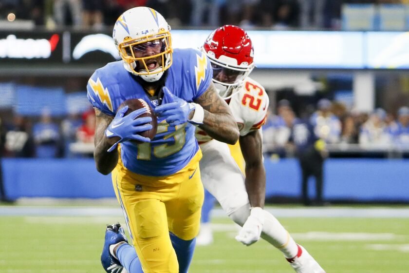 Chargers wide receiver Keenan Allen (13) catches a pass in front of Kansas City Chiefs cornerback Joshua Williams (23).