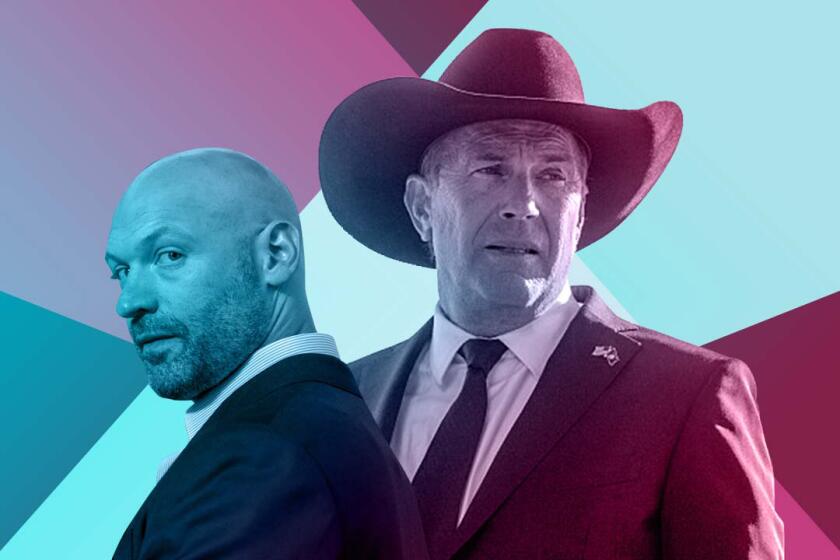 A bald man in a suit and a man in a suit with a cowboy hat. Spotlights cross behind them.