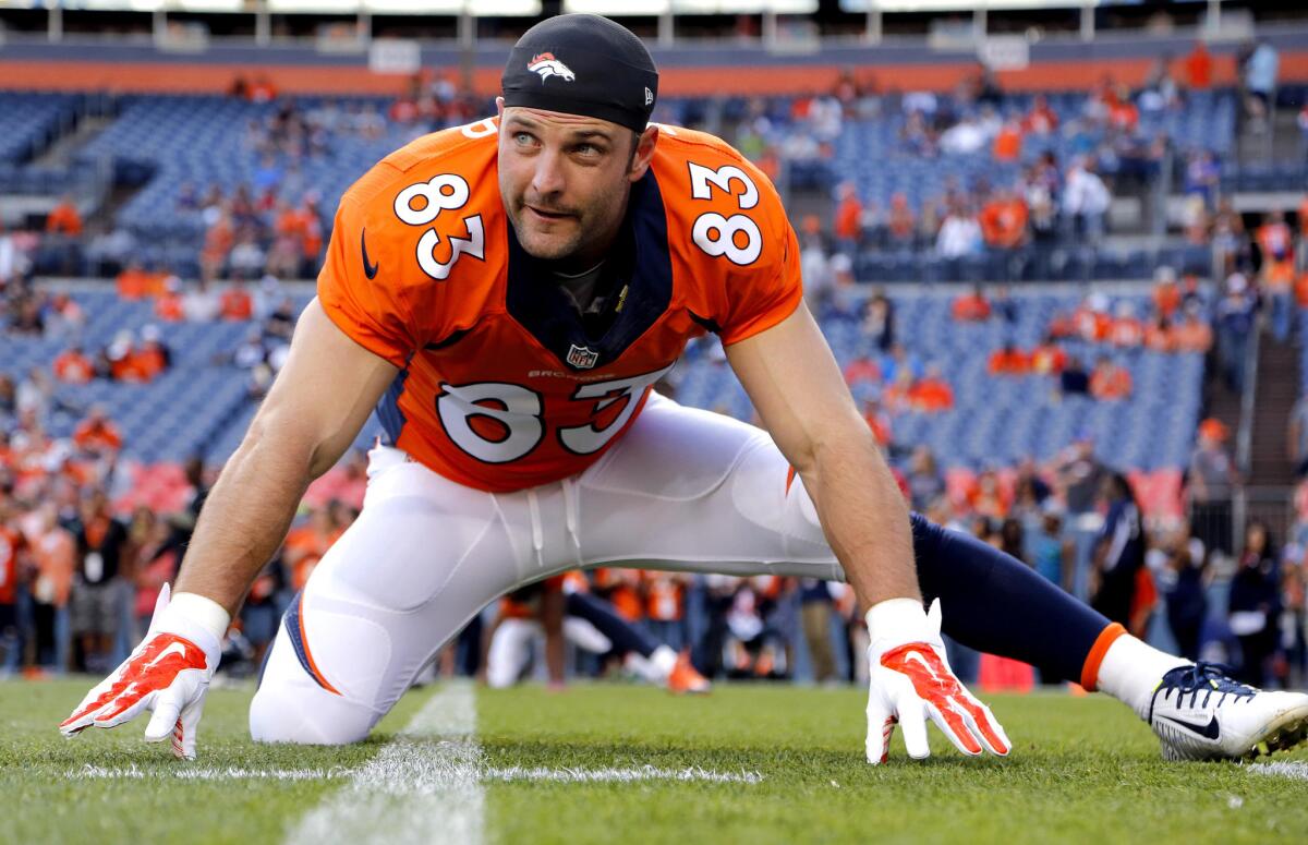 Broncos wide receiver Wes Welker (83) stretches prior to an NFL preseason game in 2014. Welker was signed by the Rams on Monday.