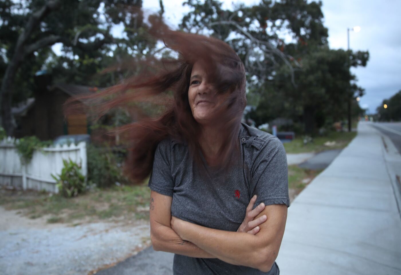 Linda Stephens checks out the weather as the force of Hurricane Florence is beginning to be felt in Myrtle Beach, S.C.