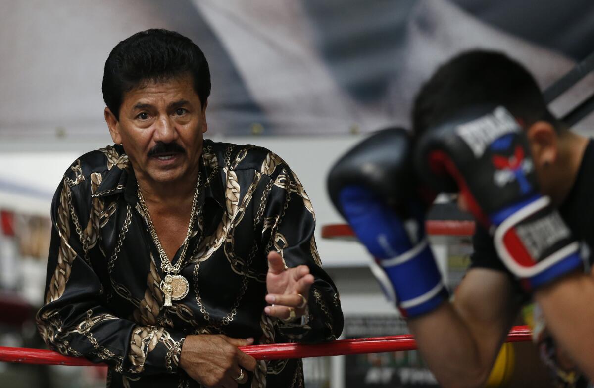 Jose Santa Cruz, left, trains his son, boxer Leo Santa Cruz, on Aug. 20.