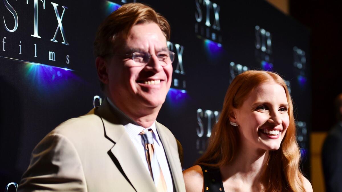 Writer Aaron Sorkin, left, and actor Jessica Chastain speak onstage at CinemaCon 2017
