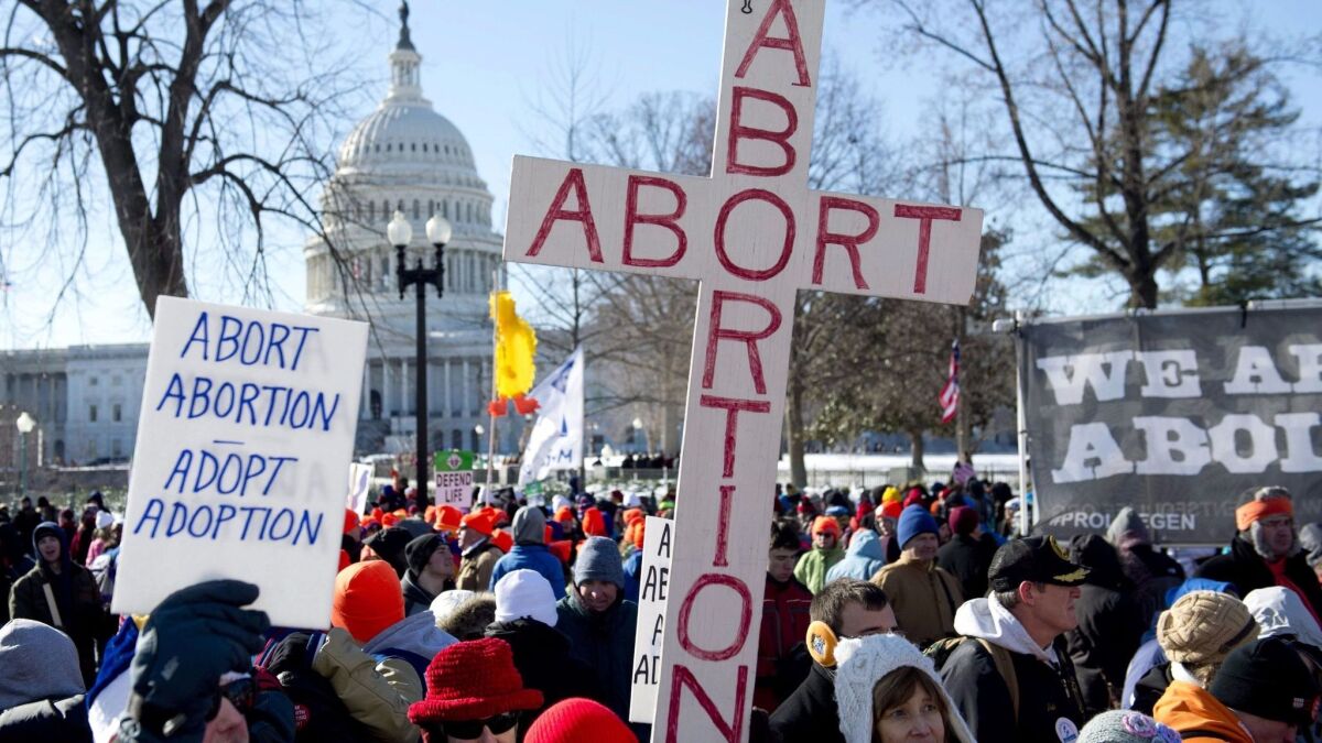 Anti-abortion demonstrators protest in front of the U.S. Supreme Court building in Washington in 2014.