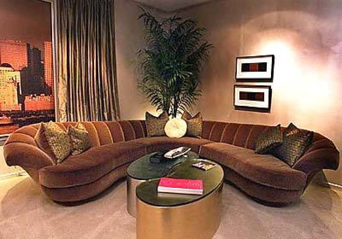 A sculptured mohair sofa by Jamie Adler.