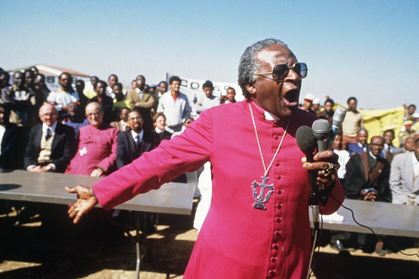 South African Archbishop Desmond Tutu speaks during the funerals of four young anti-apartheid activists victims of hand-grenade blasts, 10 July 1985, in Duduza township, near Johannesburg. (Photo by GIDEON MENDEL / AFP) (Photo by GIDEON MENDEL/AFP via Getty Images)