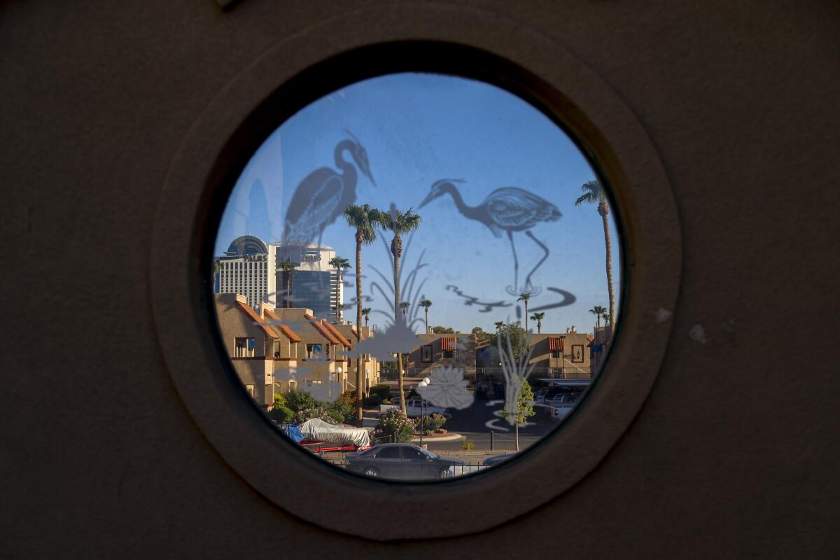 The Palms Casino Resort seen through a decorative window at Chinatown Central Plaza in Las Vegas.
