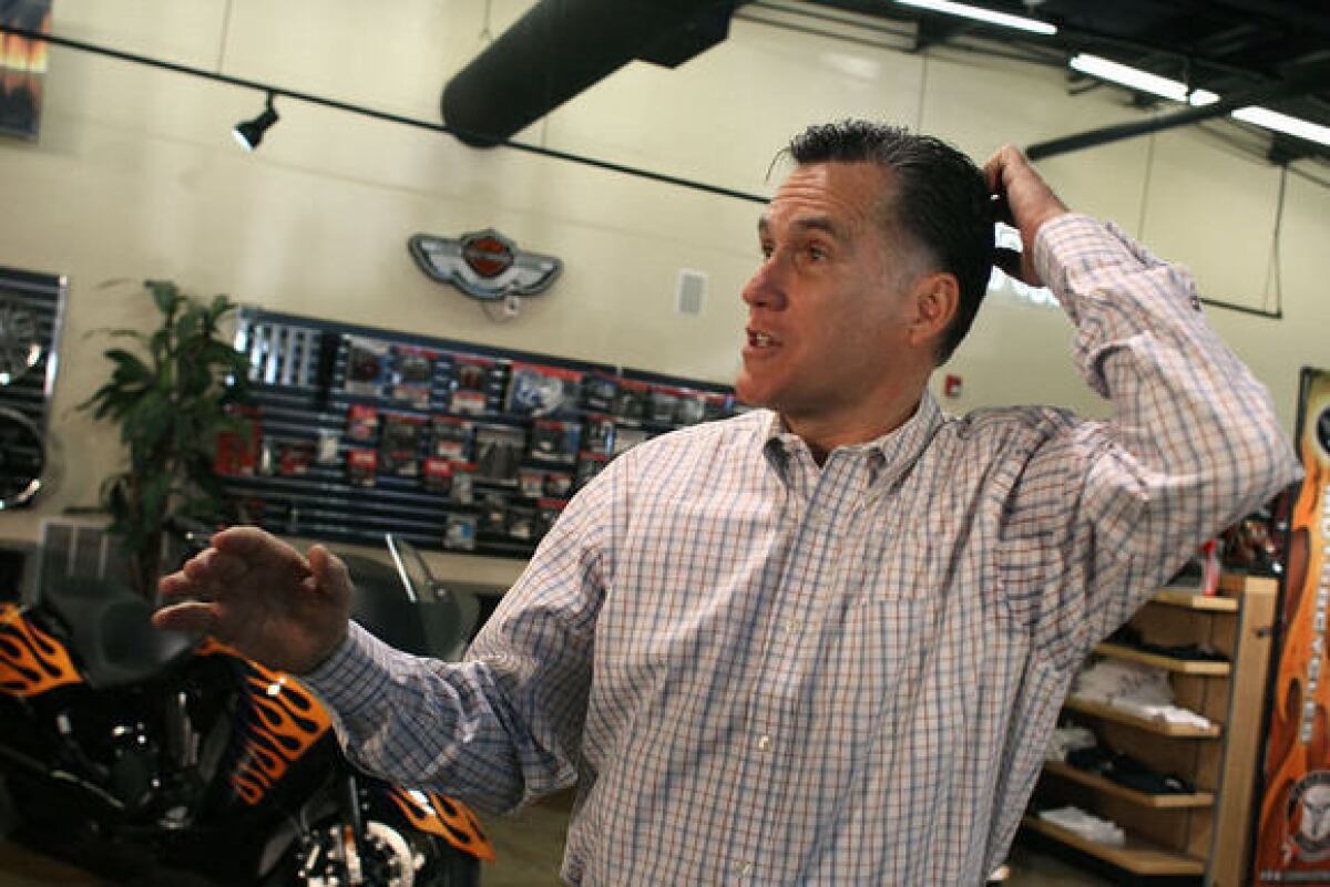 Mitt Romney speaks to the media during a campaign stop at Cherokee Trikes & More on Thursday in Greer, S.C.